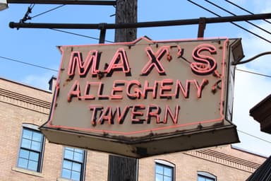 The Max's Allegheny Tavern neon sign outside the building